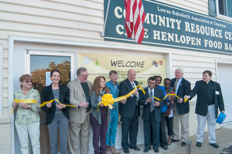 The ribbon is cut during the dedication to the Harry K Baby Pantry and WIC office. Shown (l-r) are Ellen Conway, lead volunteer for the baby pantry; Joanne White, WIC director; the Rev. Max Wolf, Lewes-Rehoboth Association of Churches; Elaine Stepany, CRC coordinator; Ted Stephens, CFAC; Rep. Pete Schwartzkopf, D-Rehoboth Beach; Harry Keswani, the Harry K Foundation; Renee Beaman, director, DHSS State Services; Janet Maull-Martin, CRC board of directors; Ted Becker, Lewes mayor; and the Rev. Jeffrey Ross, CRC board chair. BY DENY HOWETH